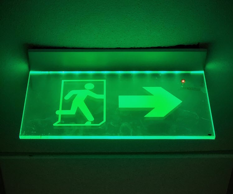 An emergency exit escape sign in green1